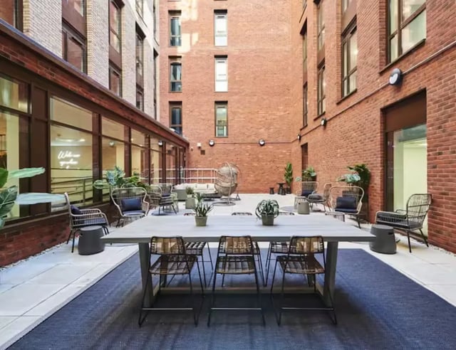 Courtyard table chairs lounge seating exterior courtyard at York House in Nottingham Student Accommodation