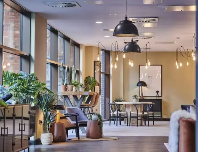 Modern communal area with plants and seating living room at York House in Nottingham Student Accommodation