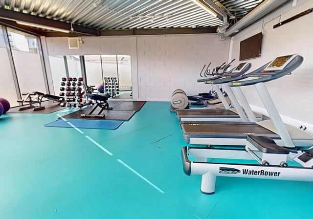 Treadmills weights benches and exercise bikes gym at iQ Student Quarter in Salford Student Accommodation