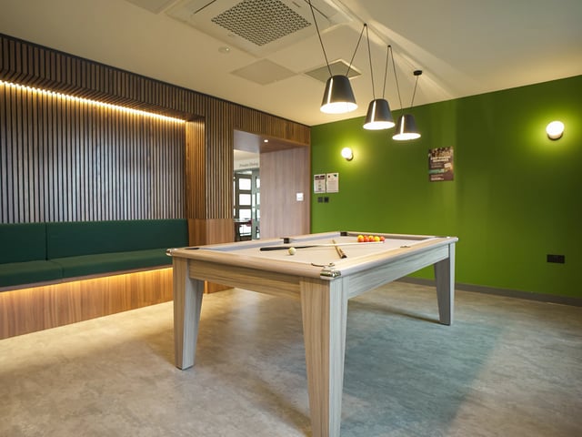 Pool table green wall built in seating communal area at Straits Garden in Egham Student Accommodation