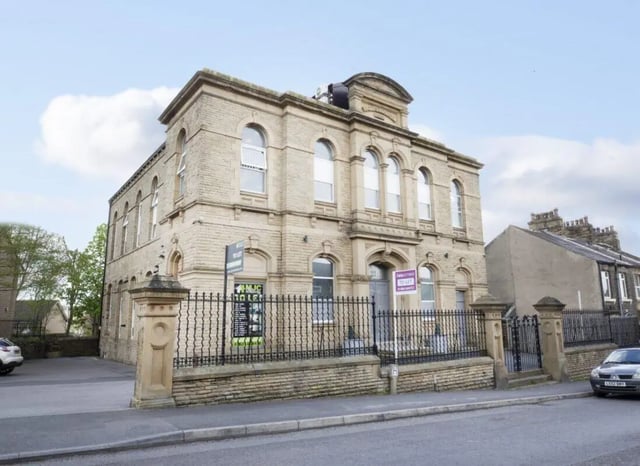 Building with fence and car exterior at The Old Chapel in Huddersfield Student Accommodation