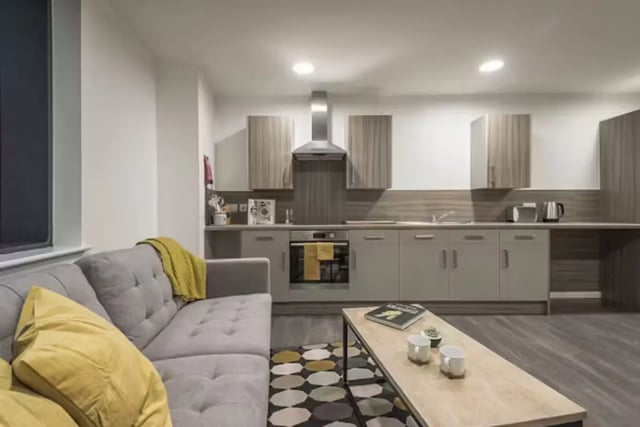 Sofa coffee table and modern kitchen living room at Hollis Croft in Sheffield Student Accommodation