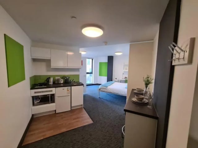 Kitchenette bed and desk student studio apartment at St James Point in Newcastle Upon Tyne Student Accommodation