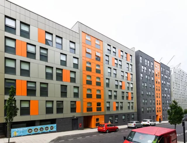 Modern apartment building with orange accents exterior at St James Point in Newcastle Upon Tyne Student Accommodation
