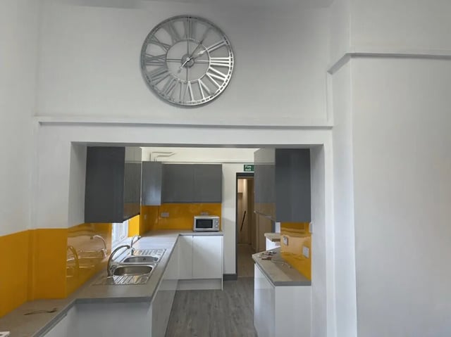 Kitchen with grey cabinets sink and microwave kitchen at Highgate in Leicester Student Accommodation