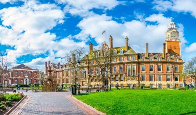 Historic buildings with a fountain and lawn exterior at Highgate in Leicester Student Accommodation