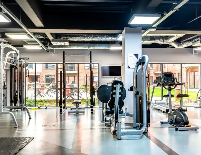 Gym equipment machines televisions and windows gym at The Glassworks - Leeds in Leeds Student Accommodation