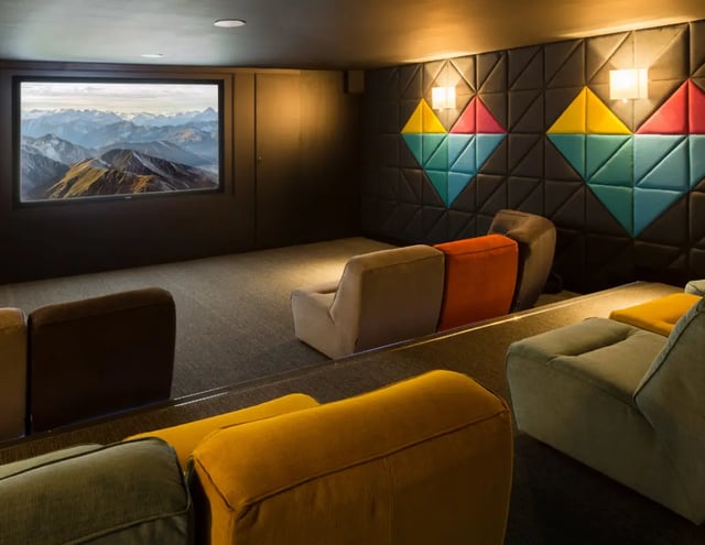 Theater room with colorful seating and projector screen Cinema at The Glassworks - Leeds in Leeds Student Accommodation