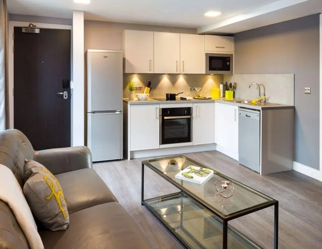 Sofa fridge oven microwave kitchen living room at The Glassworks - Leeds in Leeds Student Accommodation