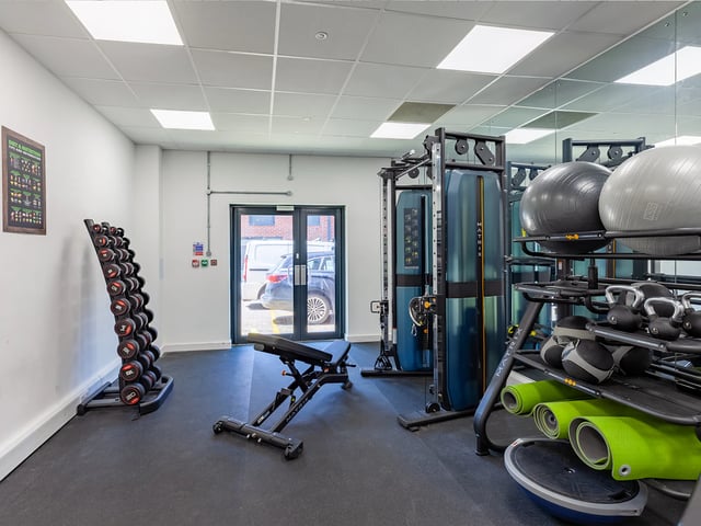Dumbbells weight bench exercise machines fitness balls gym at Hill View Place in Exeter Student Accommodation