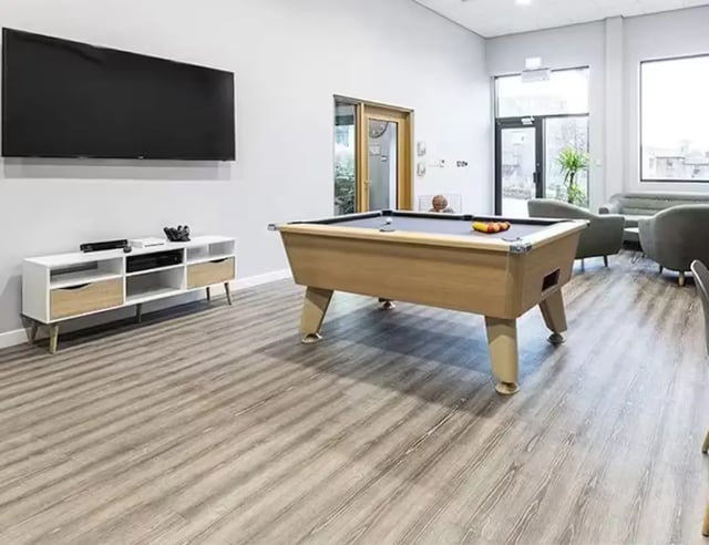 Pool table large TV white cabinet entertainment area at Central Place in Sheffield Student Accommodation