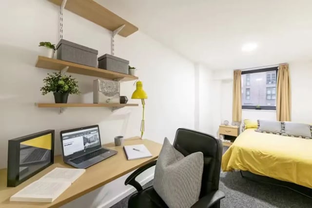 Desk shelves laptop chair and bed bedroom at Central Place in Sheffield Student Accommodation