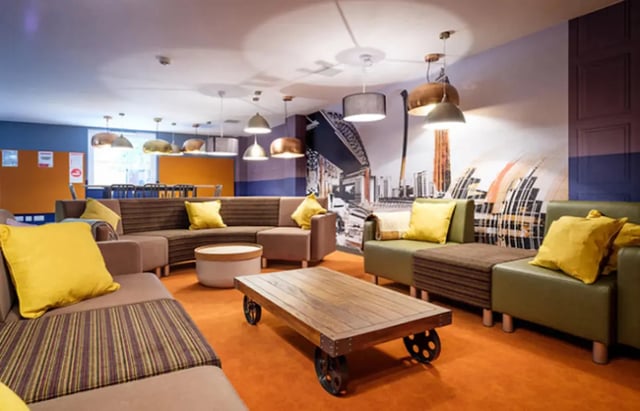 Modern lounge area with couches and coffee table Living room at Albert Place in Newcastle Upon Tyne Student Accommodation