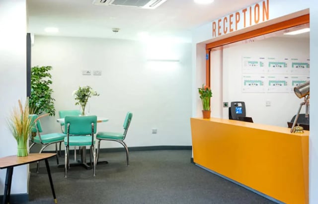 Reception desk with chairs and table at Albert Place in Newcastle Upon Tyne Student Accommodation