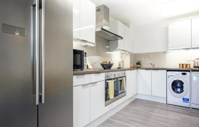 Modern kitchen with appliances and white cabinets kitchen at Albert Place in Newcastle Upon Tyne Student Accommodation