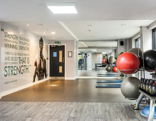 Gym equipment with motivational mural and mirrors gym at Iconinc The Triangle in Leeds Student Accommodation