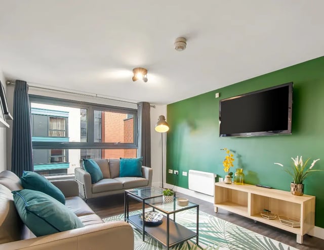 Two sofas coffee table TV living room at Iconinc The Triangle in Leeds Student Accommodation