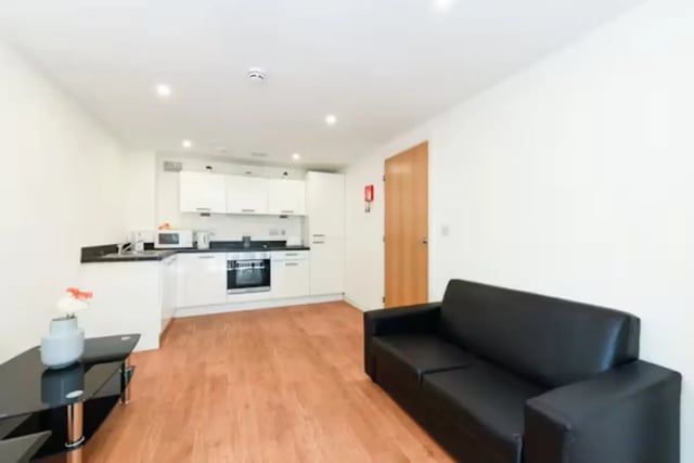 Black sofa kitchen cabinets sofa kitchen living room at Mellor House - Central Place in Sheffield Student Accommodation