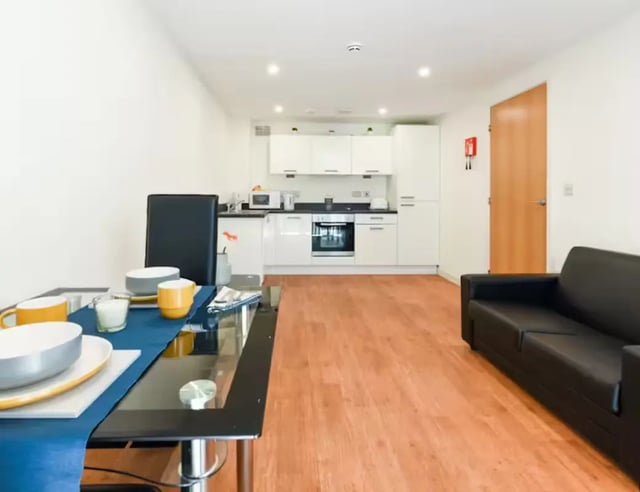 Dining table kitchen and sofa living room at Mellor House - Central Place in Sheffield Student Accommodation