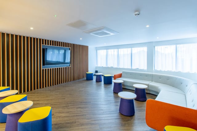 TV sofa stools and tables communal area at Renslade House in Exeter Student Accommodation