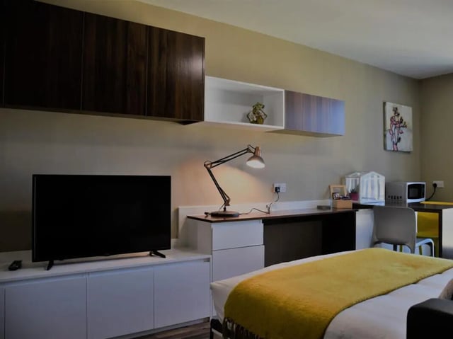 Modern student room with desk TV bed study area at Pembroke Studios in Liverpool Student Accommodation