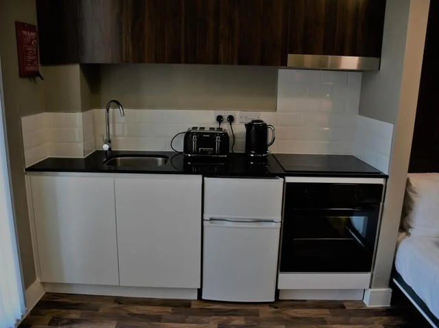Sink kettle toaster fridge oven kitchen at Pembroke Studios in Liverpool Student Accommodation