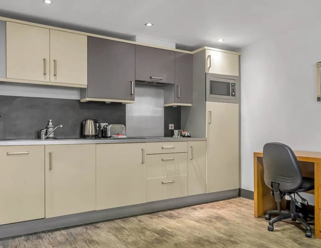 Kitchen counter microwave toaster kettle desk chair kitchen at Iconinc Leeds City West in Leeds Student Accommodation