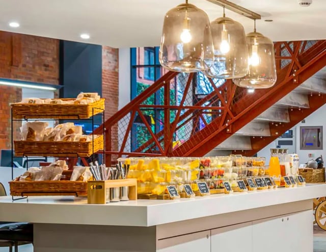 Food display with baskets and drinks communal area at Gravity in Lincoln Student Accommodation