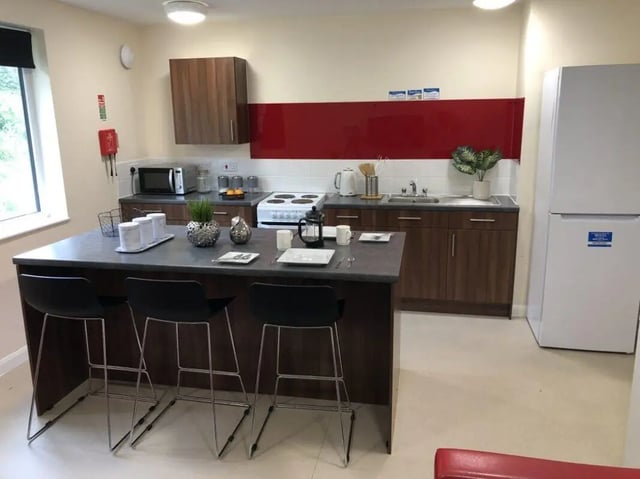 Kitchen island with stools and appliances kitchen at Jubilee Court in Preston Student Accommodation