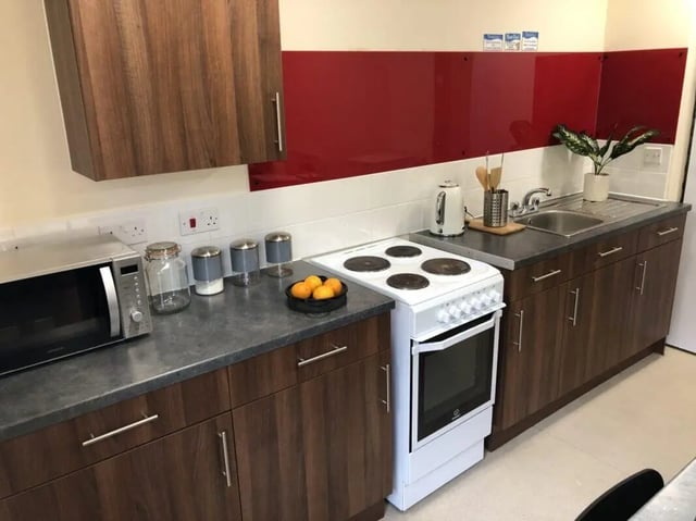 Microwave stove kettle sink cabinets kitchen at Jubilee Court in Preston Student Accommodation