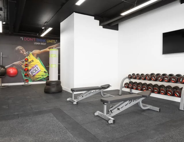 Dumbbells benches punchbag Usain Bolt gym area at The Ascent in Liverpool Student Accommodation