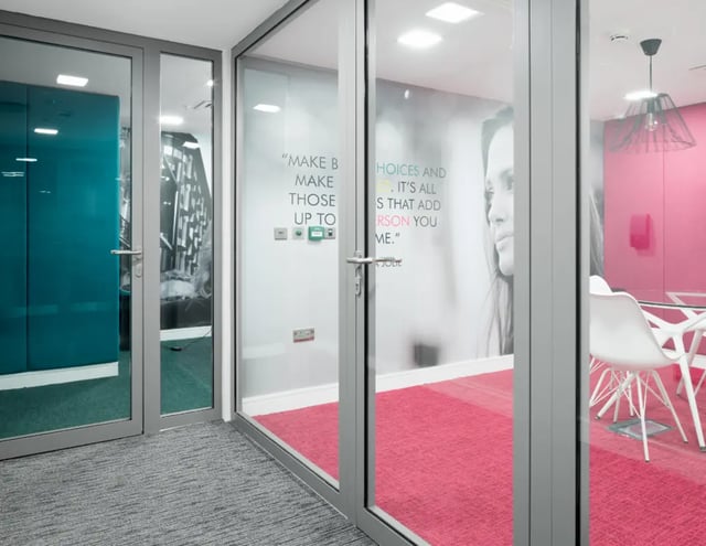 Glass partitioned room with pink carpet and chairs at The Ascent in Liverpool Student Accommodation