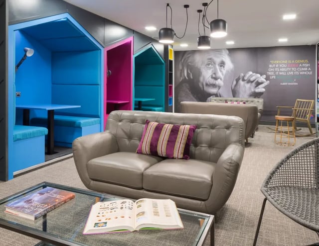 Study pods sofa glass table living room at The Ascent in Liverpool Student Accommodation