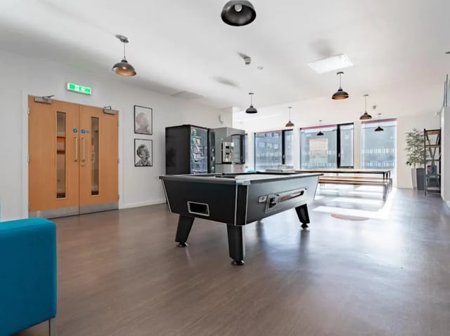 Pool table vending machines wooden doors common area at Powis Place in Aberdeen Student Accommodation