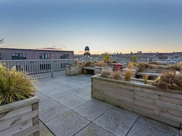 Rooftop planters benches picnic table exterior at Powis Place in Aberdeen Student Accommodation
