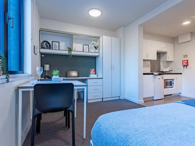Desk chair bed kitchen and wardrobe studio at Powis Place in Aberdeen Student Accommodation