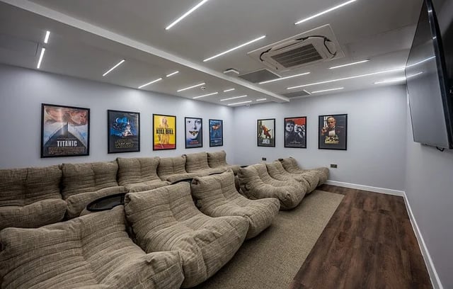 Beanbag chairs and movie posters in a room Image Type cinema room at Carters Yard in Stirling Student Accommodation