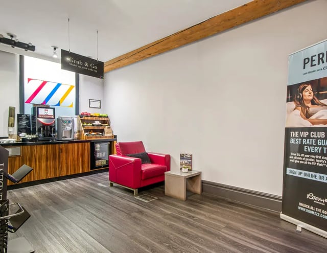 Grab and Go counter red armchair and banner lounge at IconInc Manchester City in Manchester Student Accommodation