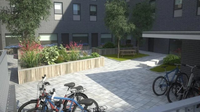 Bicycles picnic table and plants exterior at Nebula in Sheffield Student Accommodation