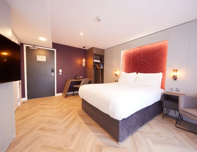 Bed desk wardrobe and TV bedroom at IconInc York City in York Student Accommodation