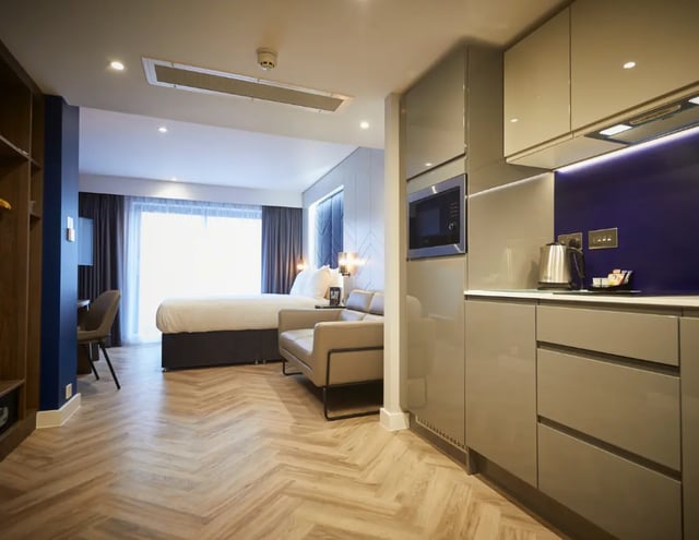 Bed sofa desk kitchen unit bedroom living area at IconInc York City in York Student Accommodation