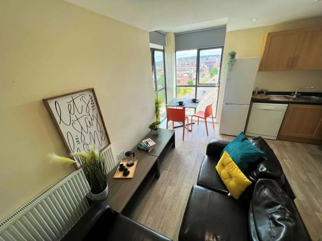 Leather sofa dining table kitchen living room at Stratus in Sheffield Student Accommodation