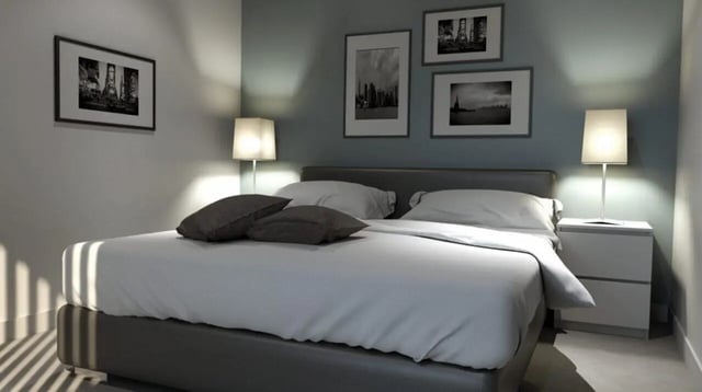 Bed with pillows lamps framed art bedroom at Stratus in Sheffield Student Accommodation