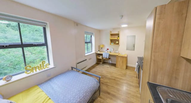 Bed desk shelves cabinets kitchen student studio at dwell Hotwells House in Bristol Student Accommodation