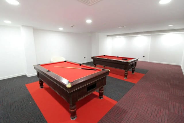 Two red billiard tables with cues playing area at Printworks in Sheffield Student Accommodation