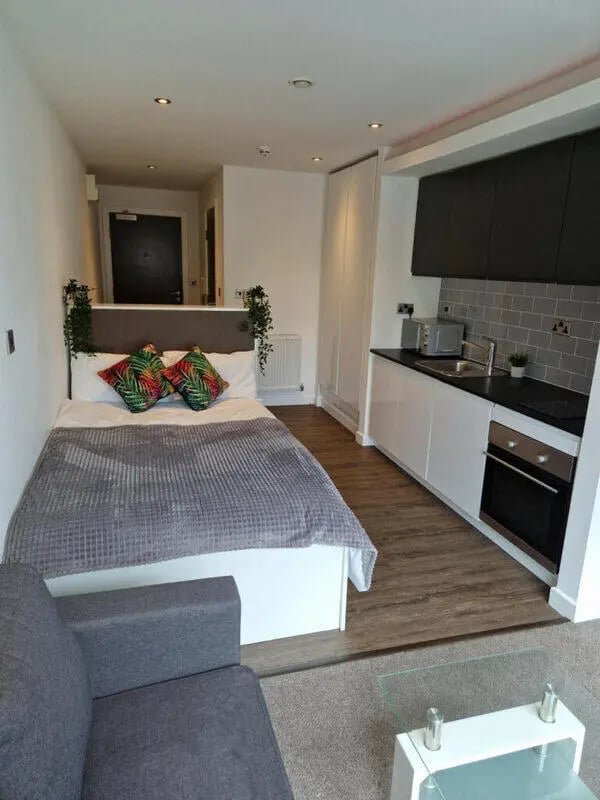 Bed sofa kitchen and oven studio apartment at Printworks in Sheffield Student Accommodation
