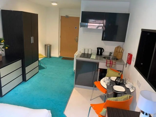 Wardrobe chest drawers kitchen table chairs kitchen bedroom at Plato House in Liverpool Student Accommodation