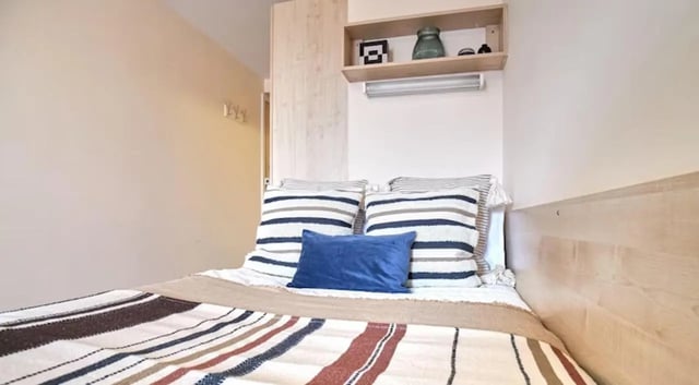 Striped pillows and blanket on bed bedroom at Rockingham House in Sheffield Student Accommodation