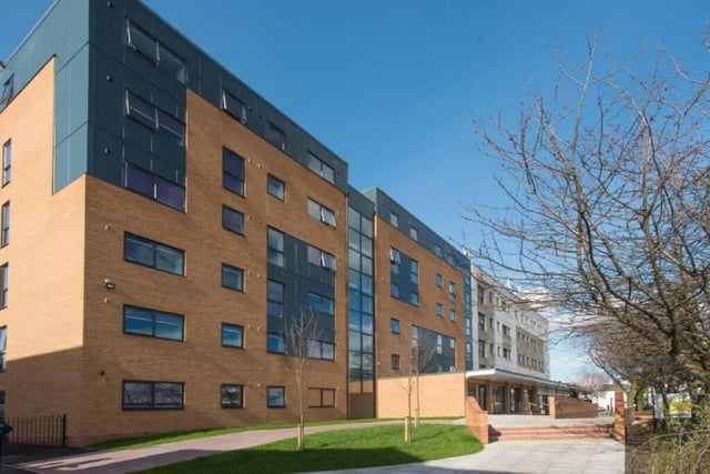 Modern brick building with many windows exterior at Stoke Student Village in Stoke-On-Trent Student Accommodation