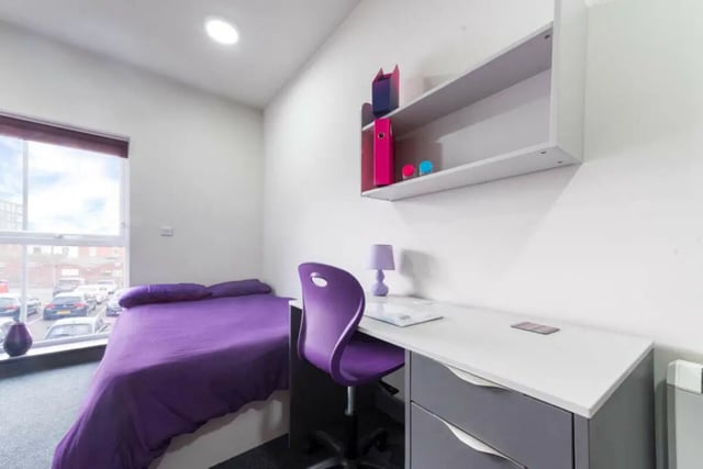Purple duvet desk chair and shelves bedroom at Stoke Student Village in Stoke-On-Trent Student Accommodation